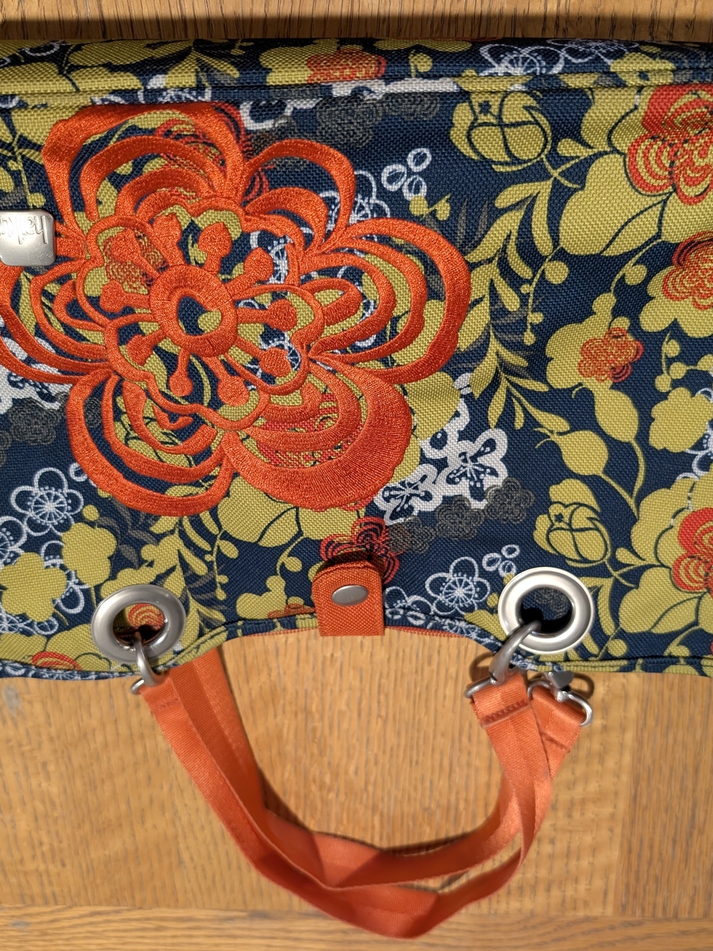 Haiku Navy Floral Sachel with Orange Embroidery and Orange Handles